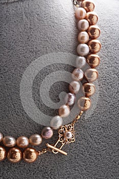 Author  pearls necklace demonstrated on maneken. close up. fashion and jewelry concept photo