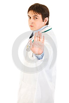 Authoritative medical doctor showing stop gesture