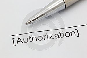 Authorization paper with line and pen photo