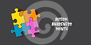 Autism awareness month horizontal banner with Multicolored puzzle isolated on grey background. Healthcare concept.