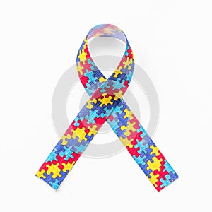 Autism awareness ribbon in puzzle or jigsaw pattern isolated on white background with clipping path for World Autism Awareness