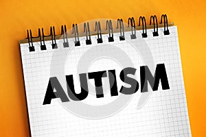 Autism - neurodevelopmental disorder characterized by difficulties with social interaction and communication, text concept on