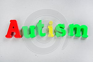 Autism word on a grey background