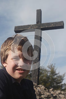 Autistic Boy By A Cross