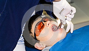 Autistic boy in dental treatment. brace. health care