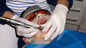 Autistic boy in dental treatment. brace. health care