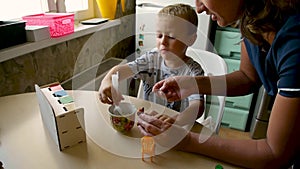 Autistic boy feeds kitty classes