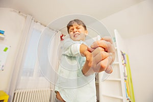 Autistic boy hands in strong negative expression