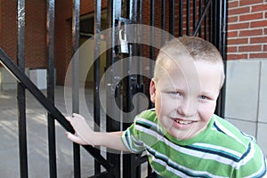 Autistic Boy At a Locked Gate
