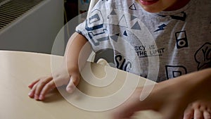 Autistic boy naughty while assembling a puzzle_closer