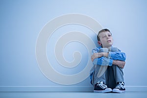 Autistic child on a floor photo