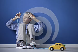 Autistic child playing with string