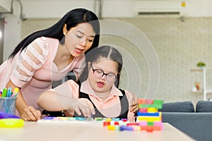 Autism girl with learning practice at home photo
