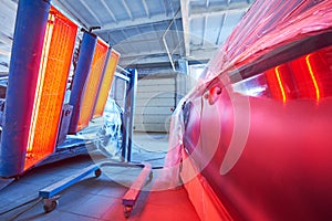 Auto body repair. infrared lamp in use