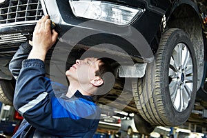 Auto car repair mechanic at work