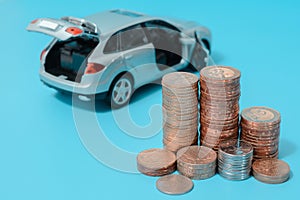 Auto loan: interest rates, car with open boot, blue background