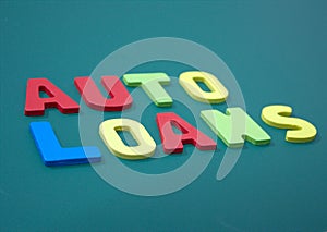 Auto Loans with wooden alphabet