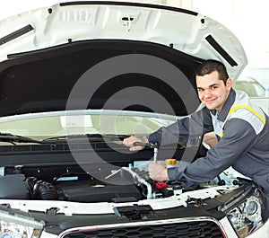 Auto mechanic in car repair
