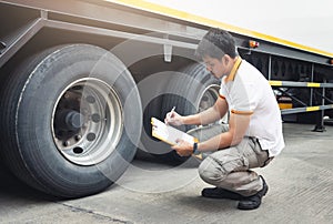 Auto Mechanic is Checking the Truck`s Safety Maintenance Checklist. Inspection Truck Safety of Semi Truck Wheels Tires
