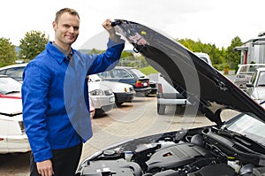 Auto mechanic checks a vehicle,