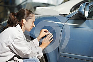 Auto mechanic colourist matching color photo