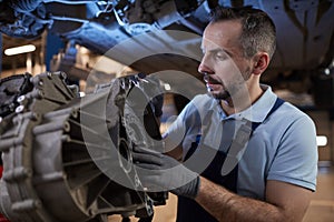 Auto Mechanic Fixing Car