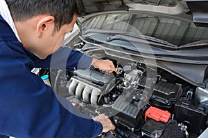 Auto mechanic fixing car