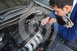 Auto mechanic fixing car