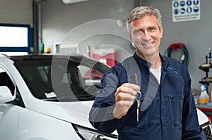 Auto Mechanic Holding Car Key