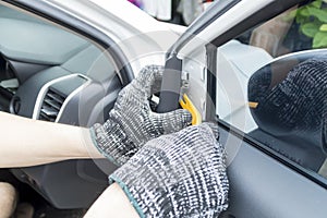 Auto mechanic remove car audio speaker, Car maintenance service