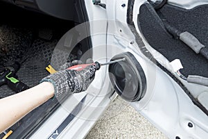 Auto mechanic remove car audio speaker, Car maintenance service