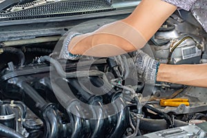 Auto mechanic repairing car. Selective focus in Thailand