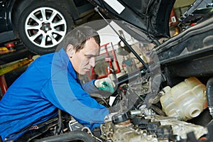 Auto mechanic repairman at work