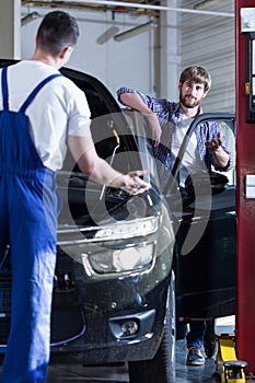 Auto mechanic servicing a car