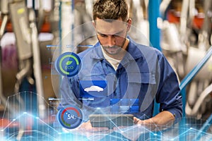 Auto mechanic or smith with tablet pc at workshop