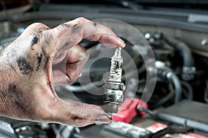 Auto mechanic and sparkplug photo