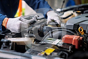 Auto mechanic working in the garage