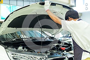 Auto mechanic working in garage, Car Repair Service center.