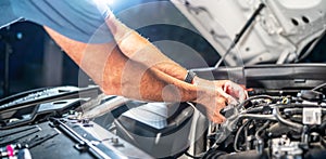 Auto mechanic working in garage. Repair service