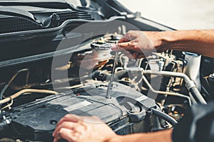 Auto mechanic working in garage Technician Hands of car mechanic working in auto repair Service and Maintenance car check