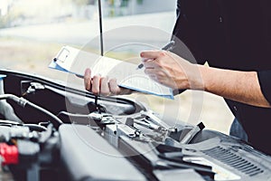 Auto mechanic working in garage Technician Hands of car mechanic working in auto repair Service and Maintenance car check