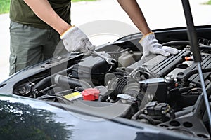 Auto mechanic working in mechanics service or garage.