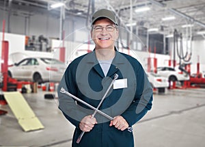 Auto mechanic with wrench.