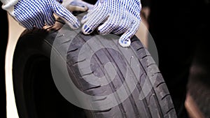 Auto mechanics repairing wheel tire with blowout