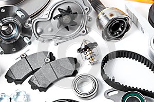 Auto parts background. Hub, pump, brake pads, filter, timing belt, rollers, constant velocity joints, thermostat and other