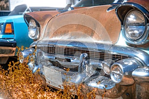 Auto Parts Store in the middle of the desert in autumn season. Old automobiles, car wreckages