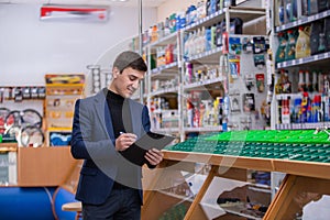 Auto parts store. The seller receives the goods.