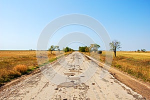 Auto road to the Prairie. Old ruined road to the steppe