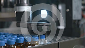 Auto sampler takes a vial and injects a sample into high performance liquid chromatography.