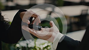 Auto Seller Giving Car Key To Female Buyer Indoor, Cropped